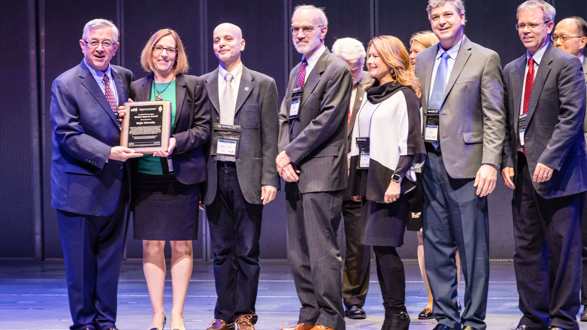 Professor Bill Poucher and Provost Nancy Brickhouse receive the University’s Global Impact Award 