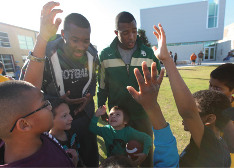 Football Team Visits Shelter