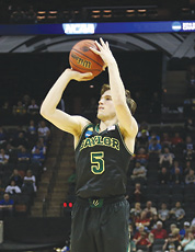Action Photo of Brady Heslip Shooting a Three Pointer