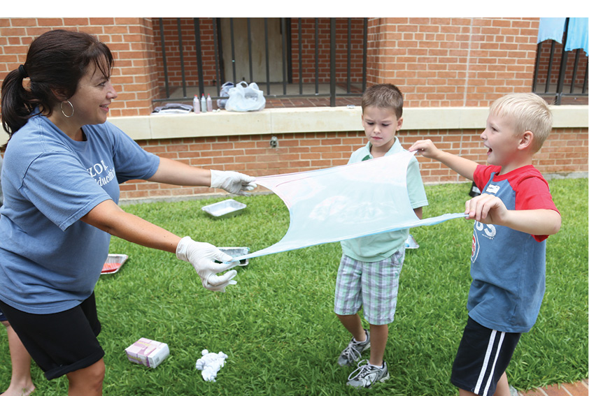photo of therapist working with two young boys
