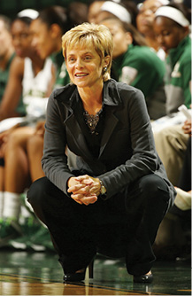 Photo of Coach Kim Mulkey in Her Signature Crouch Position on the Sideline of a Game