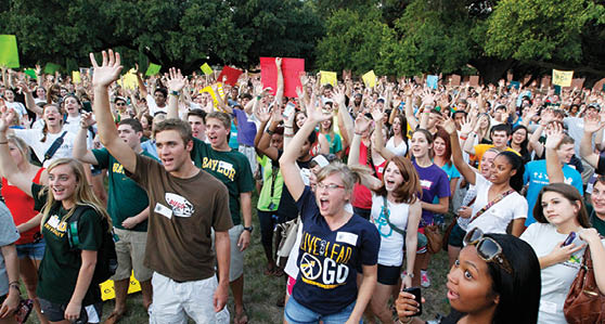Photo of Large Number of Students Performing a Sic Em
