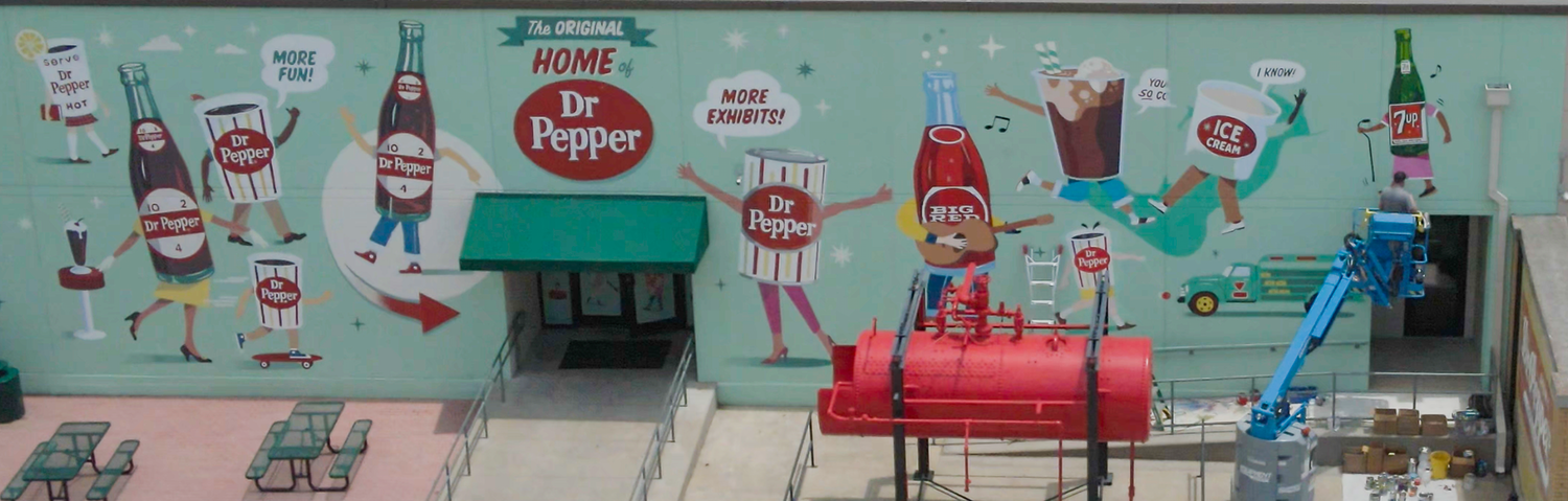 Mural of various Dr Pepper vintage iconography appearing on the wall of the Dr Pepper Museum, art byCade Kegerreis