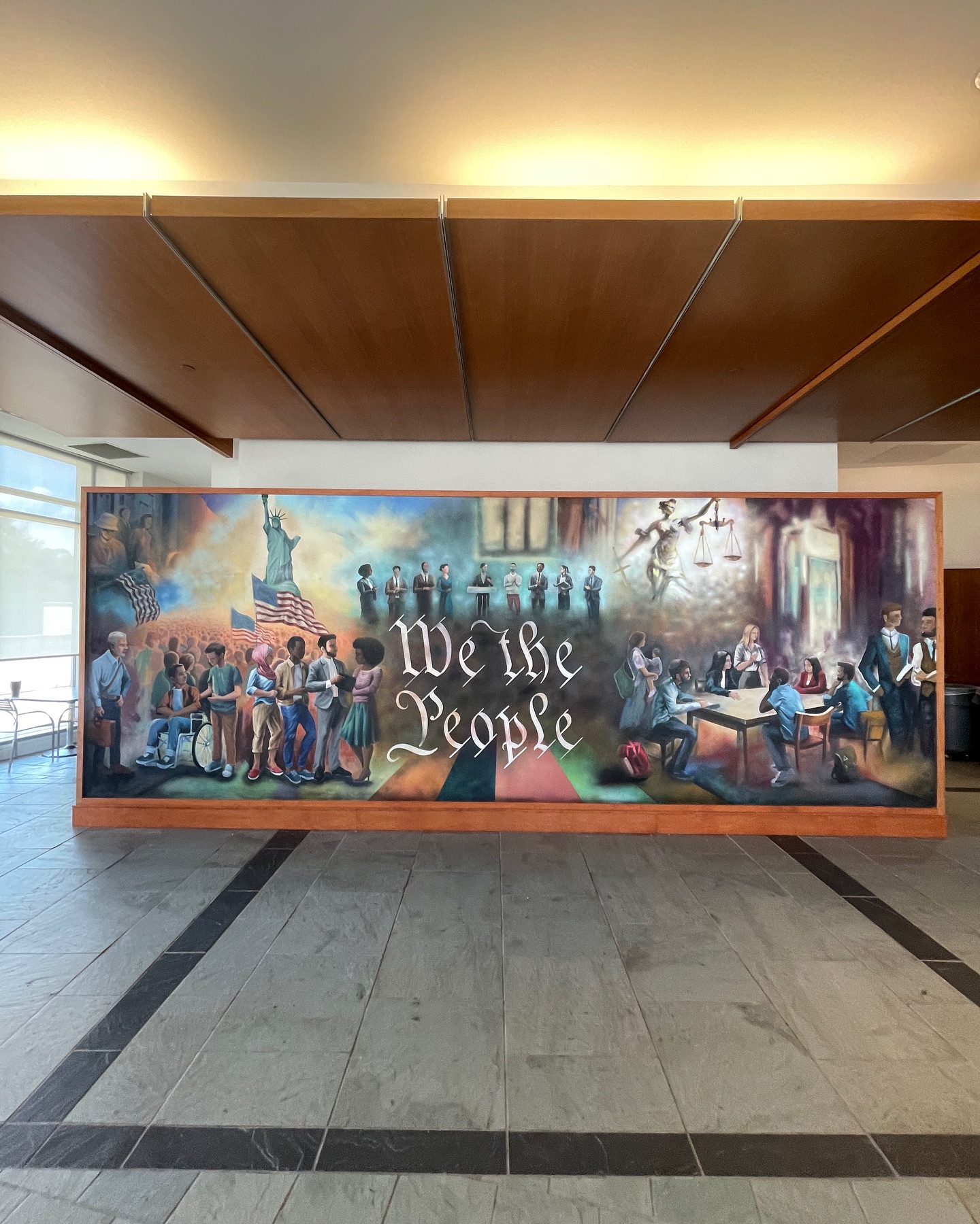 Mural painted by artist Cade Kegerreis at Baylor Law School featuring a mix of modern and historical American imagery