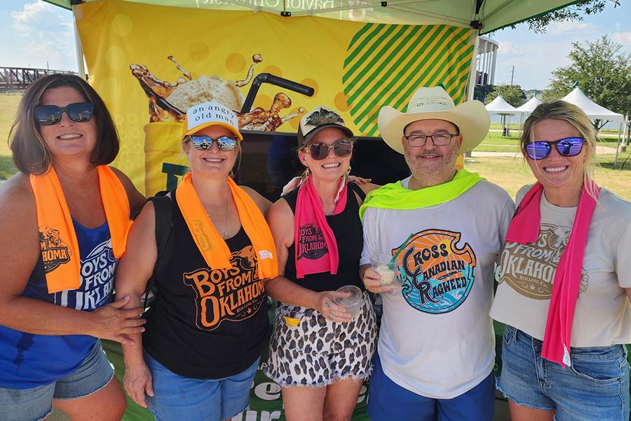 Group of concertgoers at Boys from Oklahoma concert enjoy Dr Pepper Hour Tour floats