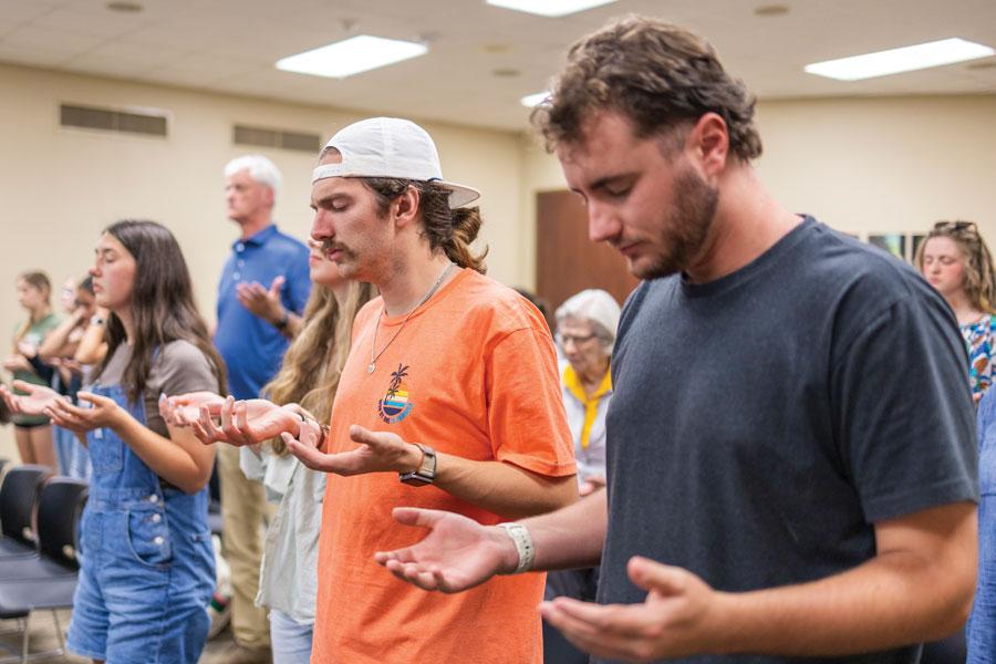 Students in prayer service