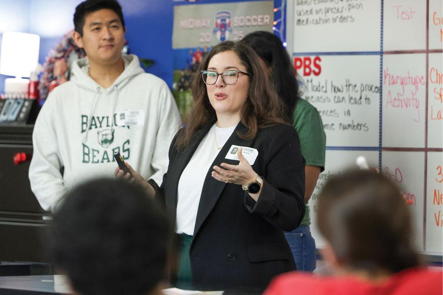 Baylor students present a STEM lesson at the front of a classroom.