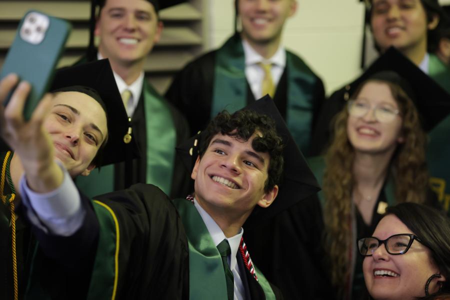 Young grads taking a selfie to celebrate taking the next step in their lives. 