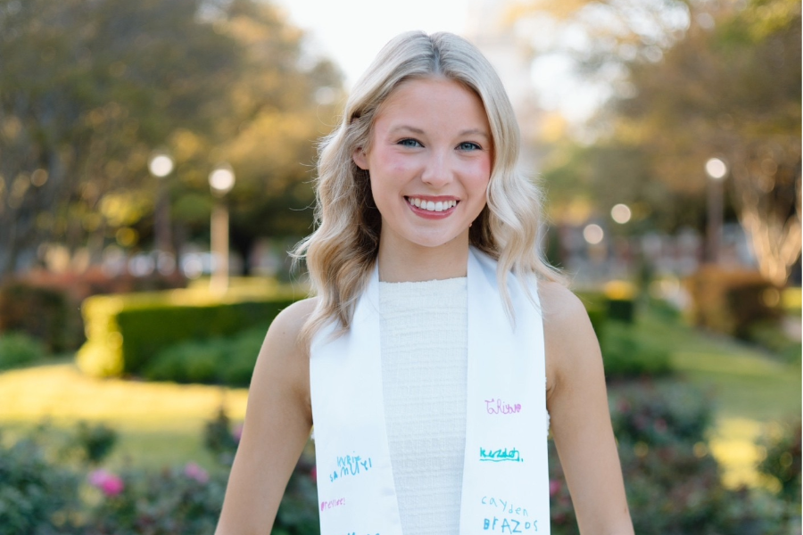 Margo Paluch wears graduation stole signed by her students.