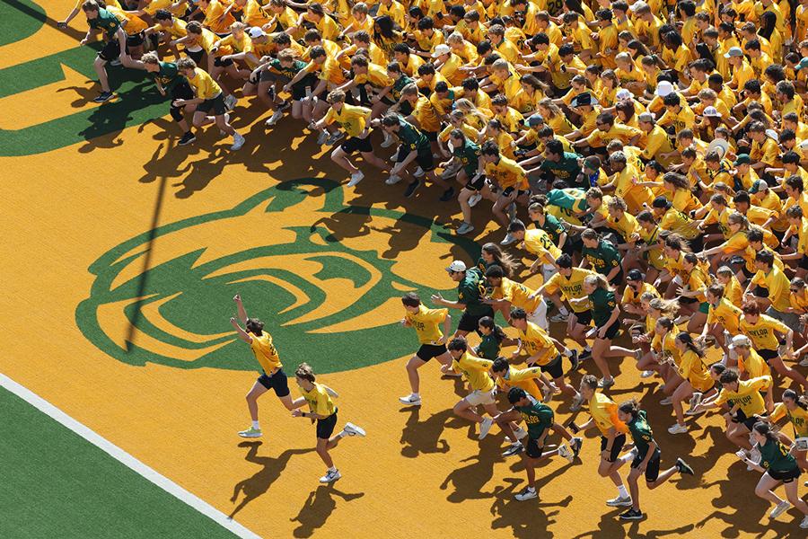 Students running the Baylor Line