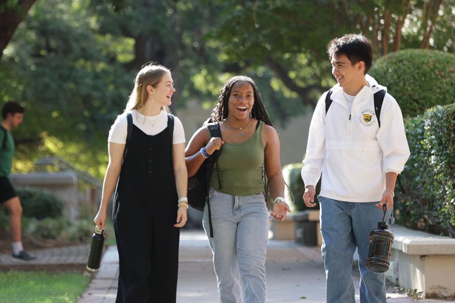 Happy students walking on campus